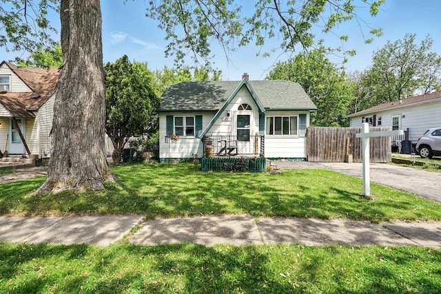 1471 James St, Burton, MI 48529 - view of front of property featuring roof with shingles and a chimney