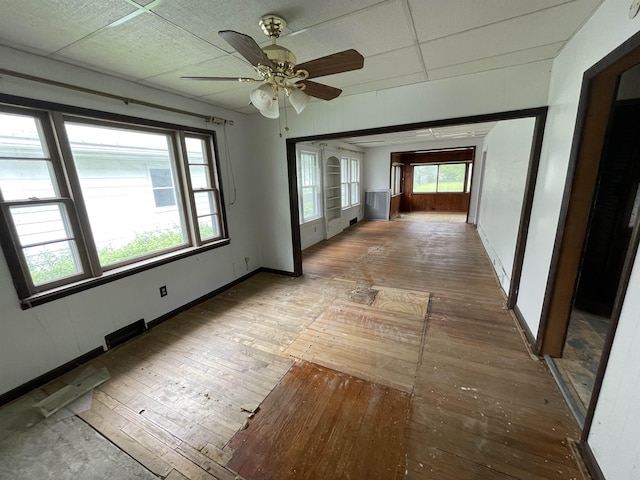 1625 N Oakley St, Saginaw, MI 48602 - unfurnished room with wood-type flooring, a ceiling fan, and healthy amount of natural light