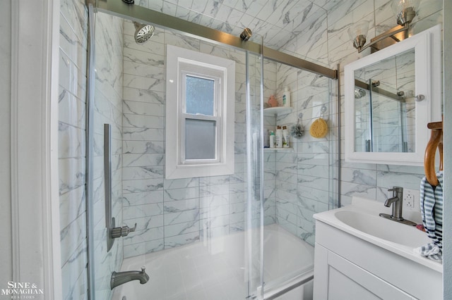 622 Kendon Dr, Lansing, MI 48910 - full bathroom with bath / shower combo with glass door, vanity, and tile walls