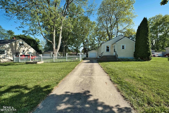 622 Kendon Dr, Lansing, MI 48910 - view of front facade with a garage and an outbuilding
