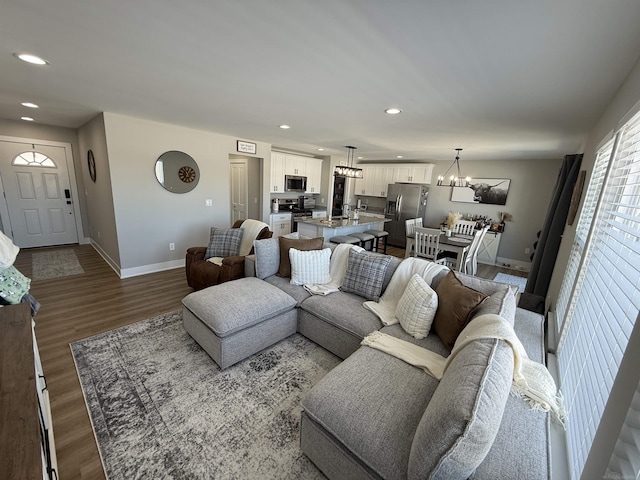 34317 Pratt Rd, Memphis, MI 48041 - living area with baseboards, dark wood-style flooring, a chandelier, and recessed lighting