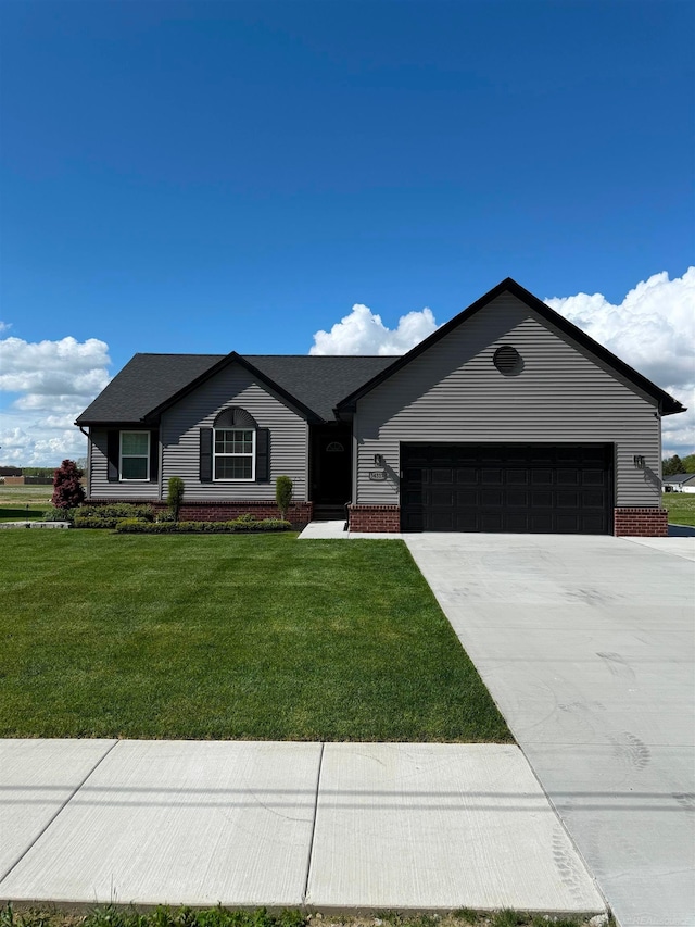 34317 Pratt Rd, Memphis, MI 48041 - single story home featuring an attached garage, concrete driveway, a front lawn, and brick siding