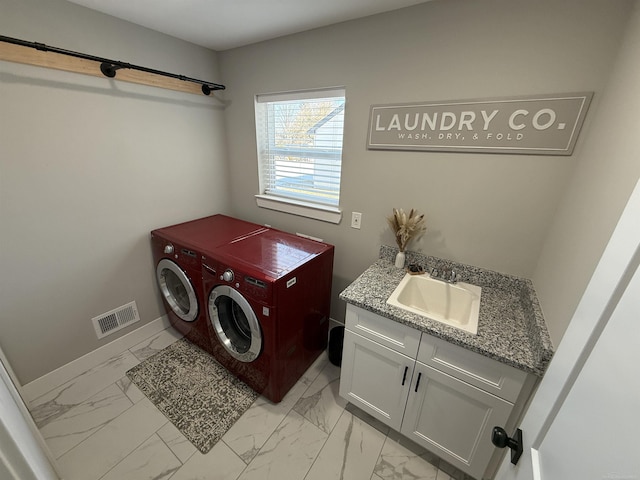 34317 Pratt Rd, Memphis, MI 48041 - laundry room featuring washer and clothes dryer, light marble finish floors, cabinet space, and baseboards