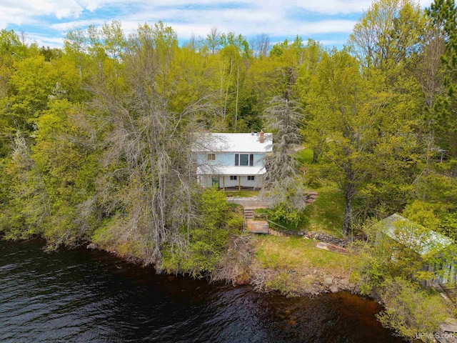 514/324 S Brook St, Michigamme, MI 49861 - view of subject property with a large body of water and a heavily wooded area