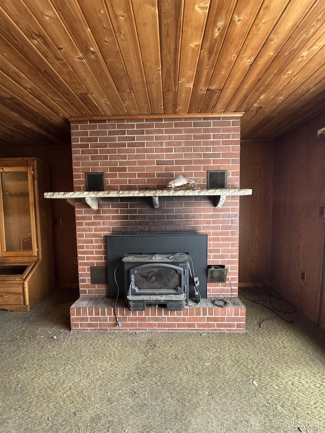 514/324 S Brook St, Michigamme, MI 49861 - detailed view of wooden ceiling, carpet floors, a wood stove, and wood walls