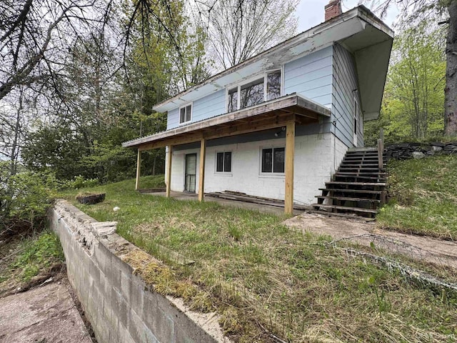514/324 S Brook St, Michigamme, MI 49861 - view of front facade with stairway and a chimney