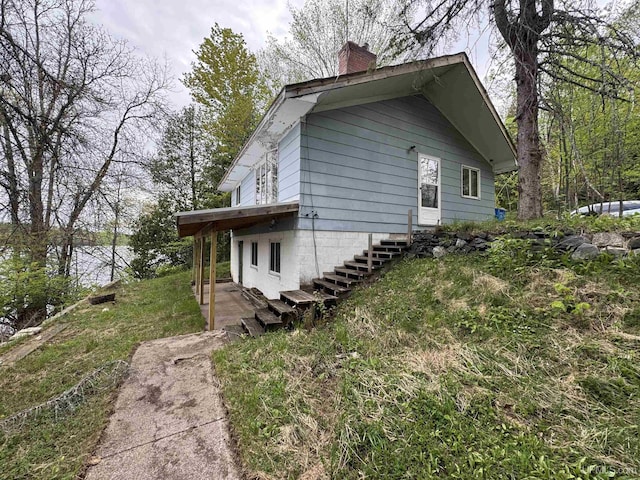 514/324 S Brook St, Michigamme, MI 49861 - view of side of home with a chimney and stairway