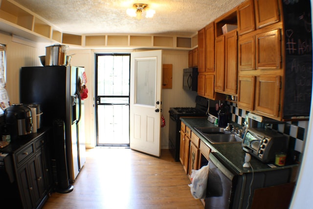 11330 Packard Ave, Warren, MI 48089 - kitchen with black appliances, a textured ceiling, a sink, brown cabinetry, and open shelves