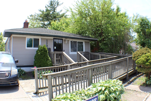 11330 Packard Ave, Warren, MI 48089 - view of front of home with a chimney and a deck