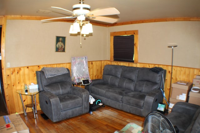 11330 Packard Ave, Warren, MI 48089 - living room with wooden walls, a ceiling fan, a wainscoted wall, and wood finished floors