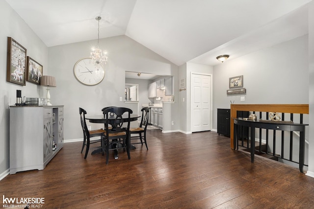 56214 Troon Dr, Shelby Twp, MI 48316 - dining room with dark wood-style flooring, a chandelier, vaulted ceiling, and baseboards
