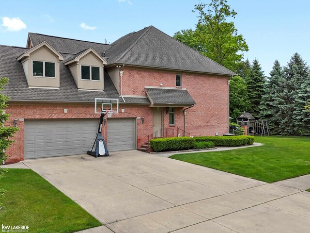 12954 Blue Lakes Cir, Shelby Twp, MI 48315 - view of front of property with concrete driveway, brick siding, a front yard, roof with shingles, and a garage