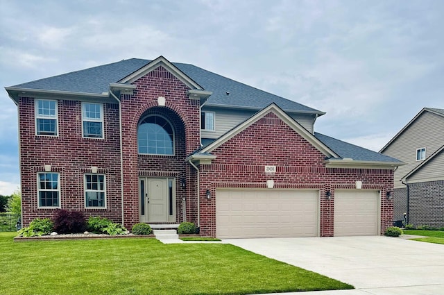 29696 Kevin Rd, New Baltimore, MI 48051 - traditional-style home featuring brick siding, driveway, a front yard, an attached garage, and a shingled roof