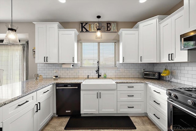 29696 Kevin Rd, New Baltimore, MI 48051 - kitchen with appliances with stainless steel finishes, a sink, white cabinetry, and decorative backsplash