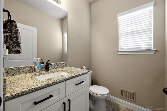 29696 Kevin Rd, New Baltimore, MI 48051 - bathroom with vanity, toilet, and baseboards