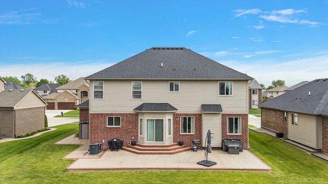 29696 Kevin Rd, New Baltimore, MI 48051 - rear view of property with brick siding, a patio, and a yard