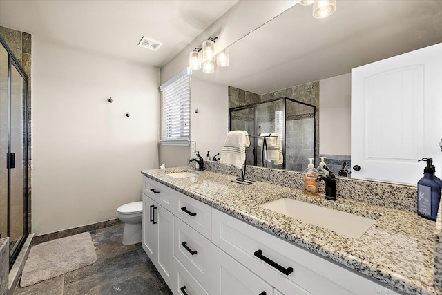 29696 Kevin Rd, New Baltimore, MI 48051 - full bathroom featuring double vanity, a shower stall, baseboards, toilet, and stone finish flooring