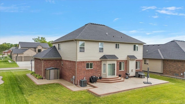 29696 Kevin Rd, New Baltimore, MI 48051 - back of house with a patio, brick siding, a lawn, entry steps, and a shingled roof