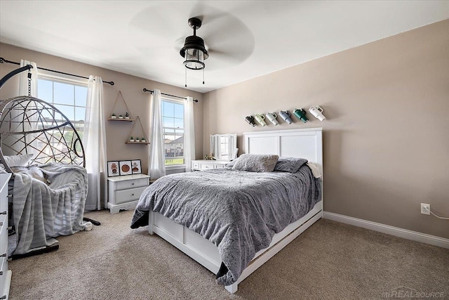 29696 Kevin Rd, New Baltimore, MI 48051 - bedroom with light colored carpet, baseboards, and a ceiling fan