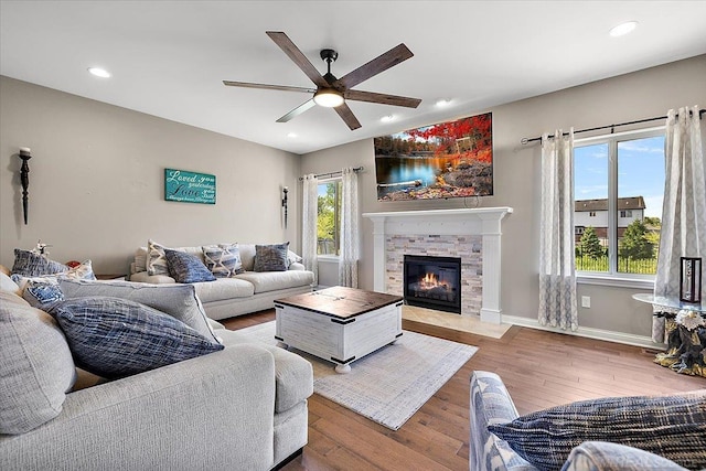 29696 Kevin Rd, New Baltimore, MI 48051 - living room with a ceiling fan, wood finished floors, a fireplace, recessed lighting, and baseboards