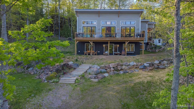 509 Red Rd, Michigamme, MI 49861 - rear view of house with a wooden deck