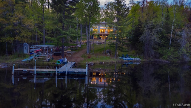 509 Red Rd, Michigamme, MI 49861 - back of house with a water view and a forest view