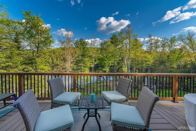 509 Red Rd, Michigamme, MI 49861 - wooden deck featuring a wooded view