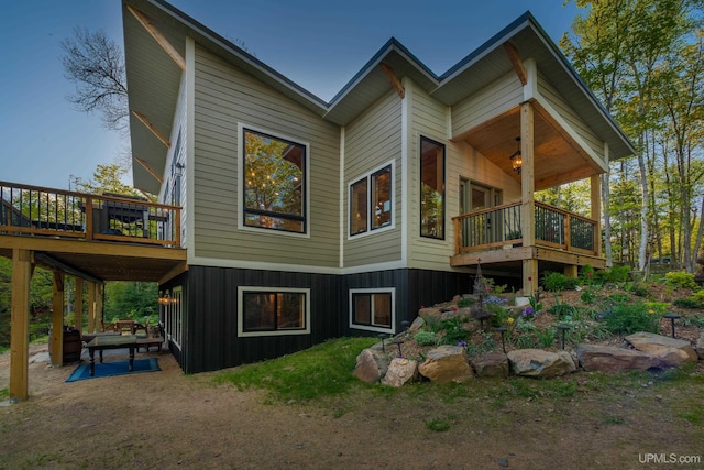 509 Red Rd, Michigamme, MI 49861 - view of side of home featuring board and batten siding and a wooden deck