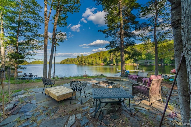 509 Red Rd, Michigamme, MI 49861 - dock area featuring a water view, an outdoor fire pit, and a patio