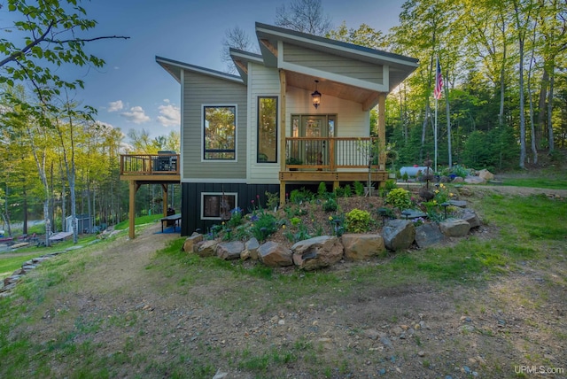 509 Red Rd, Michigamme, MI 49861 - view of front of home with a deck and board and batten siding