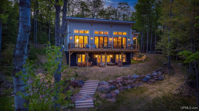 509 Red Rd, Michigamme, MI 49861 - rear view of house with stairway, a deck, and a patio area