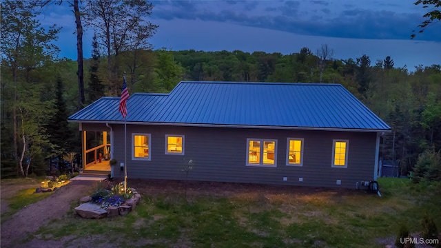 509 Red Rd, Michigamme, MI 49861 - rear view of property featuring a forest view and metal roof
