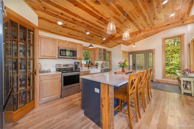 509 Red Rd, Michigamme, MI 49861 - kitchen featuring appliances with stainless steel finishes, wood ceiling, light wood-type flooring, light countertops, and vaulted ceiling