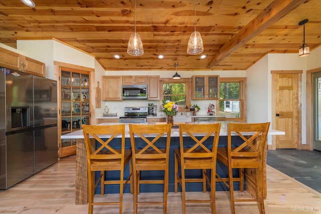 509 Red Rd, Michigamme, MI 49861 - kitchen featuring stainless steel appliances, wood ceiling, light countertops, light wood-style floors, and glass insert cabinets