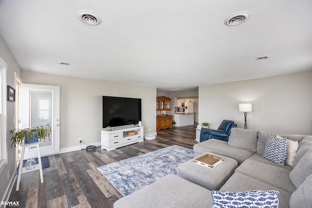 5227 Pointe Tremble Rd, Algonac, MI 48001 - living area featuring baseboards and dark wood-style flooring