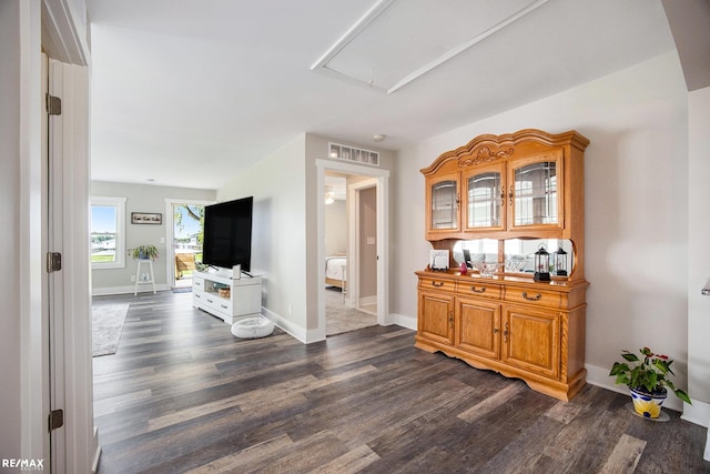 5227 Pointe Tremble Rd, Algonac, MI 48001 - hallway with attic access, dark wood-type flooring, and baseboards