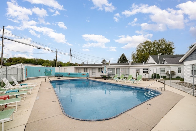 5616 W Houghton Lake Dr, Houghton Lake, MI 48629 - community pool featuring a patio