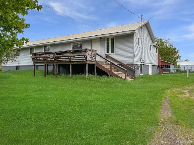W5624 County Road 388th Rd, Hermansville, MI 49847 - rear view of property featuring a deck and metal roof