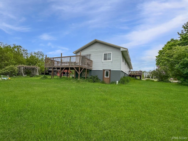 W5624 County Road 388th Rd, Hermansville, MI 49847 - rear view of house featuring a deck and a yard