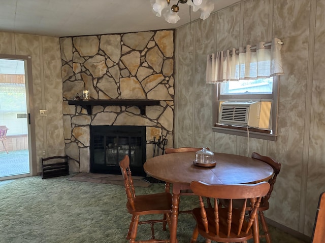 5316 Birchwood Ave, Gladwin, MI 48624 - carpeted dining space with cooling unit and a stone fireplace