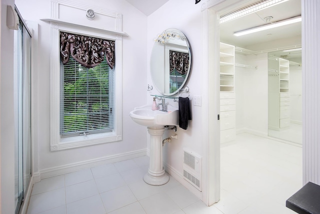 37207 27 Mile Rd, Roads, Lenox, MI 48048 - full bathroom featuring a walk in closet, baseboards, and a shower with door