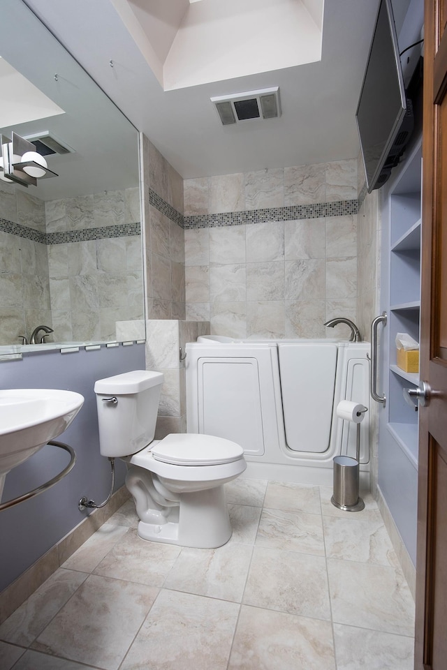 37207 27 Mile Rd, Roads, Lenox, MI 48048 - full bathroom with tile walls, toilet, and a garden tub