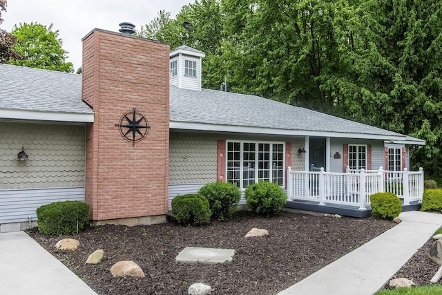 37207 27 Mile Rd, Roads, Lenox, MI 48048 - view of front of home with roof with shingles, a porch, and a chimney