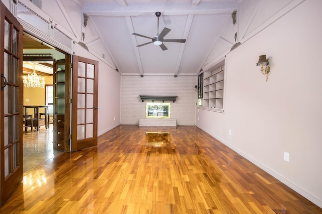 37207 27 Mile Rd, Roads, Lenox, MI 48048 - unfurnished living room with light wood-type flooring, brick wall, baseboards, a ceiling fan, and a chandelier