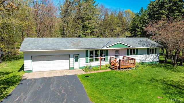 26514 Hendrickson Rd, Calumet, MI 49913 - ranch-style home featuring driveway, a front lawn, an attached garage, and roof with shingles