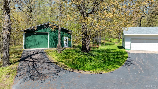 26514 Hendrickson Rd, Calumet, MI 49913 - view of yard with an outbuilding and a garage