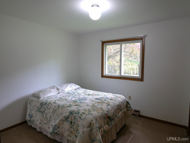 26514 Hendrickson Rd, Calumet, MI 49913 - carpeted bedroom with baseboards and a baseboard radiator