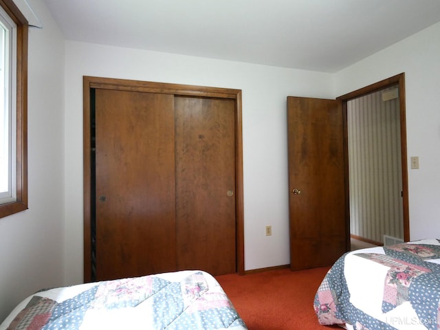 26514 Hendrickson Rd, Calumet, MI 49913 - bedroom with carpet floors and a closet