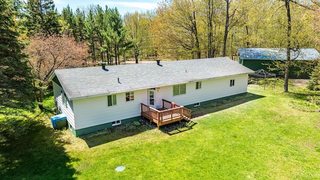 26514 Hendrickson Rd, Calumet, MI 49913 - back of property with a deck, a lawn, and roof with shingles