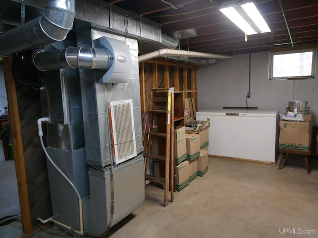 26514 Hendrickson Rd, Calumet, MI 49913 - basement featuring fridge and heating unit